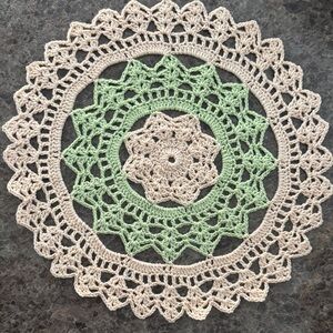 Crochet Doily with Green and Cream Pattern